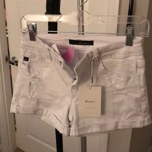 White denim distressed shorts